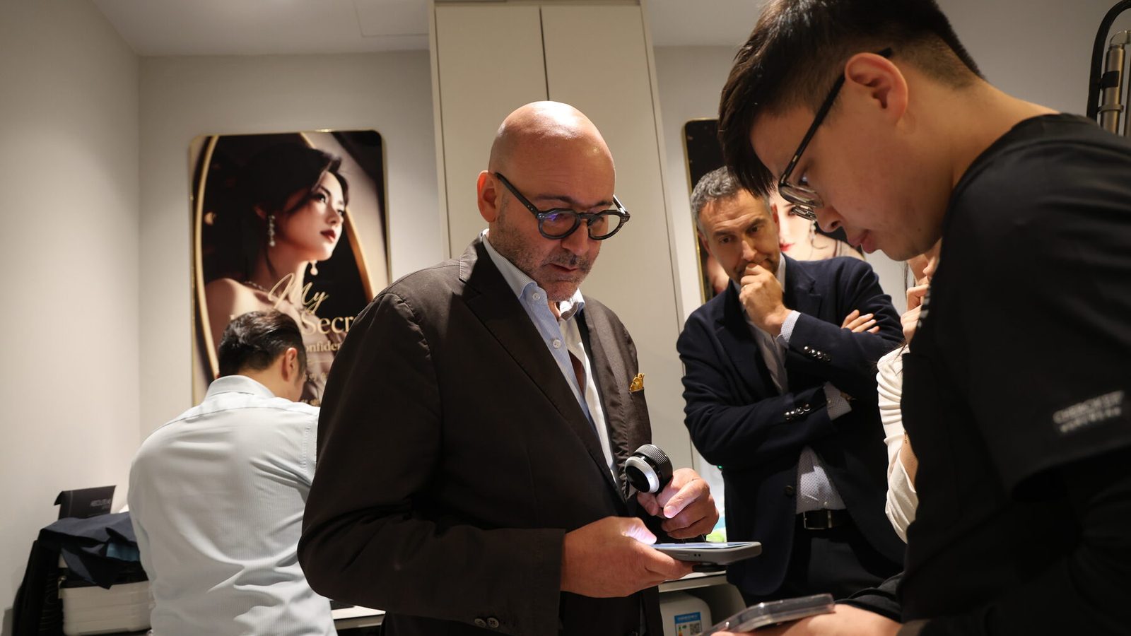 Picosecond laser handpiece under clinical review at a DEKA training session with Dr Sin Yong