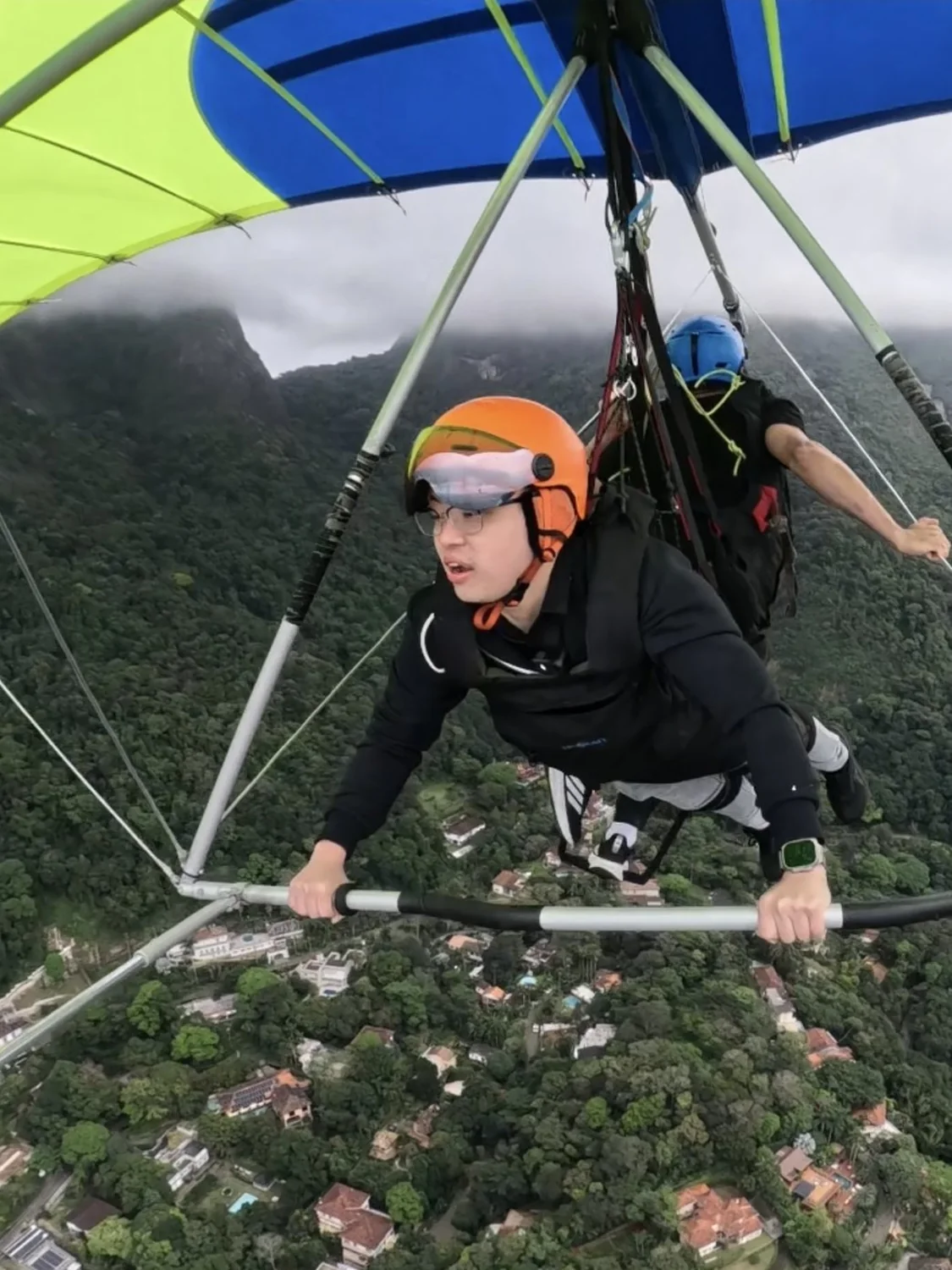 Dr Sin Yong hang gliding above Rio de Janeiro on the final morning of the Brazil trip