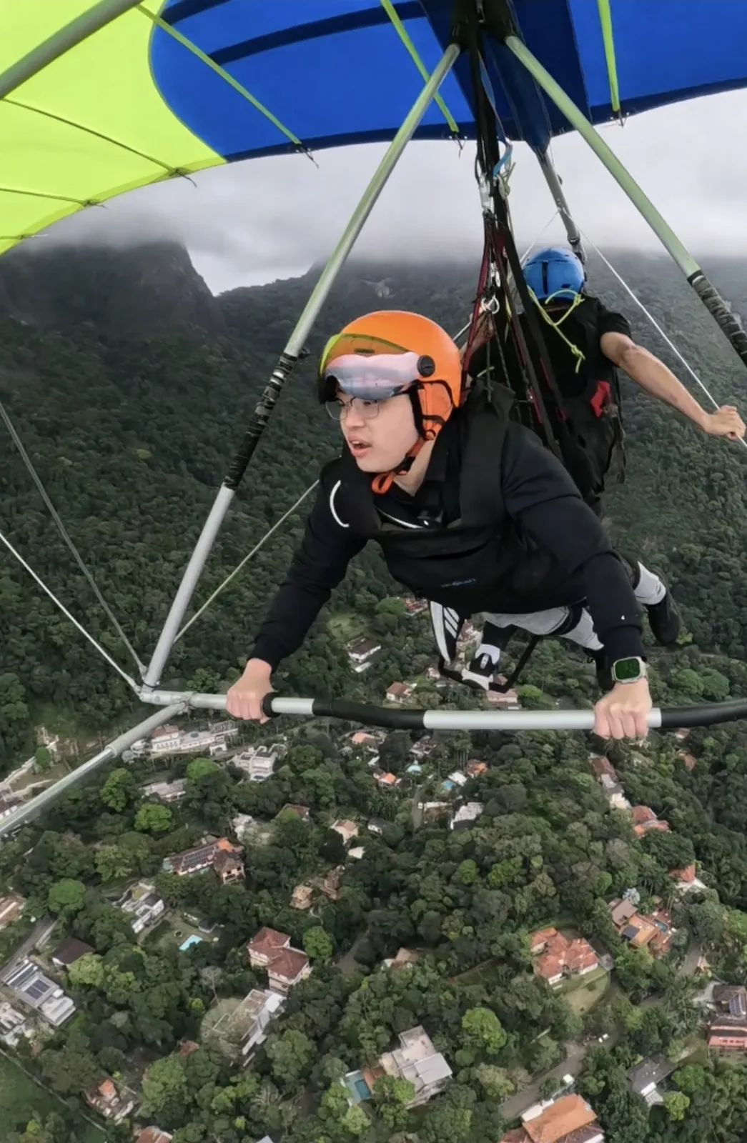 Dr Sin Yong hang gliding above Rio de Janeiro on the final morning of the Brazil trip