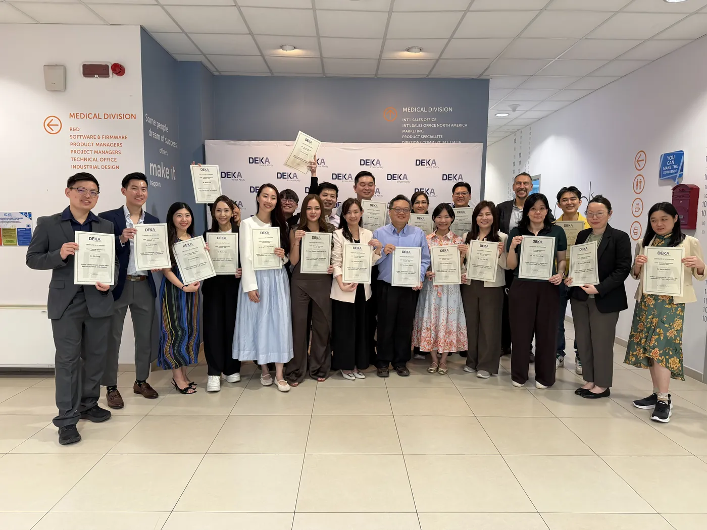 Physicians holding their DEKA Academy certificates at the El.En. headquarters