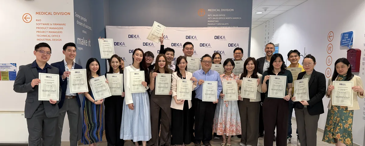 Dr Sin Yong with fellow physicians holding their DEKA Academy certificates at the El.En. headquarters, Florence