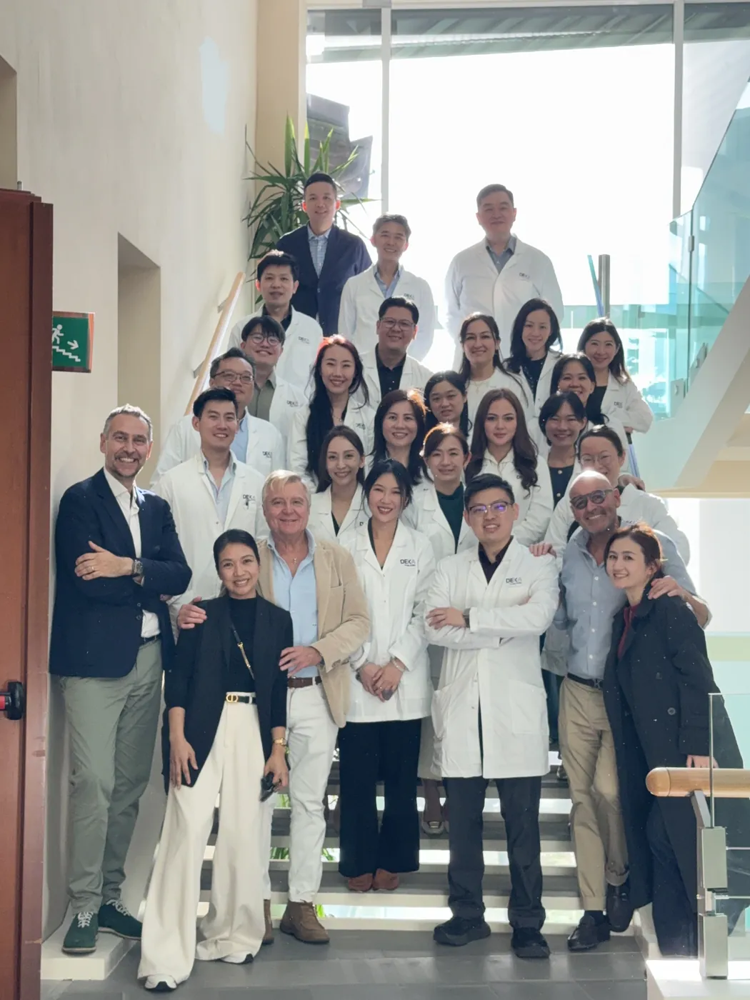 The DEKA Academy group on the staircase at Villa Donatello, with Dr Giustino beside Dr Sin Yong