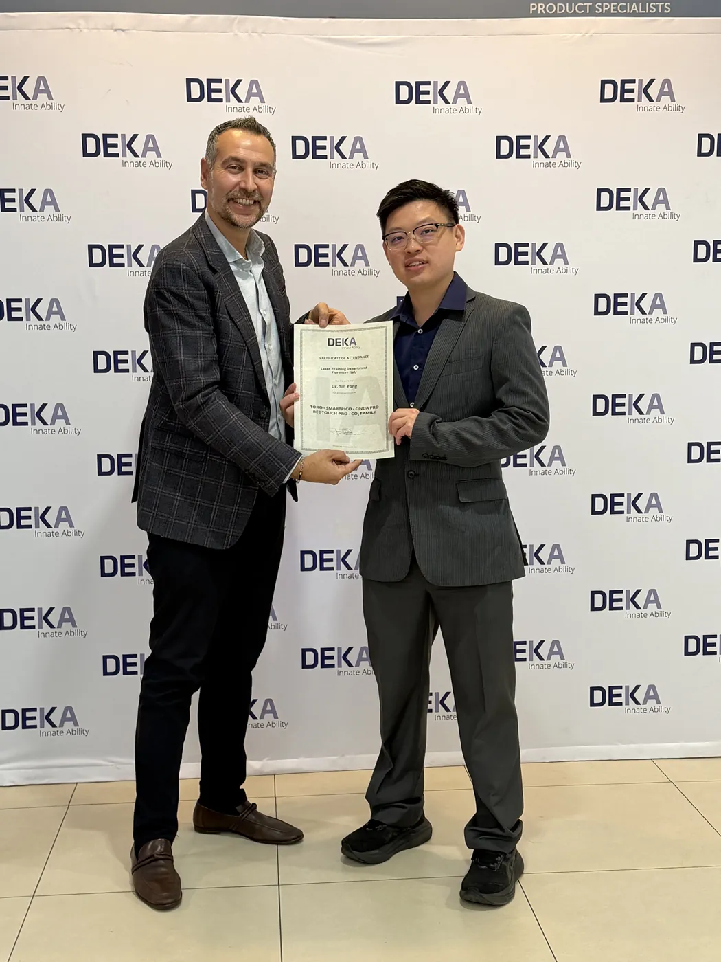 Dr Sin Yong receiving his DEKA Academy certificate of attendance in Calenzano