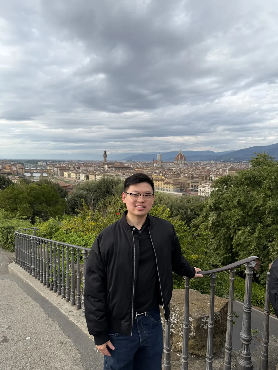 Dr Sin Yong at Piazzale Michelangelo with the Florence skyline and the Duomo behind