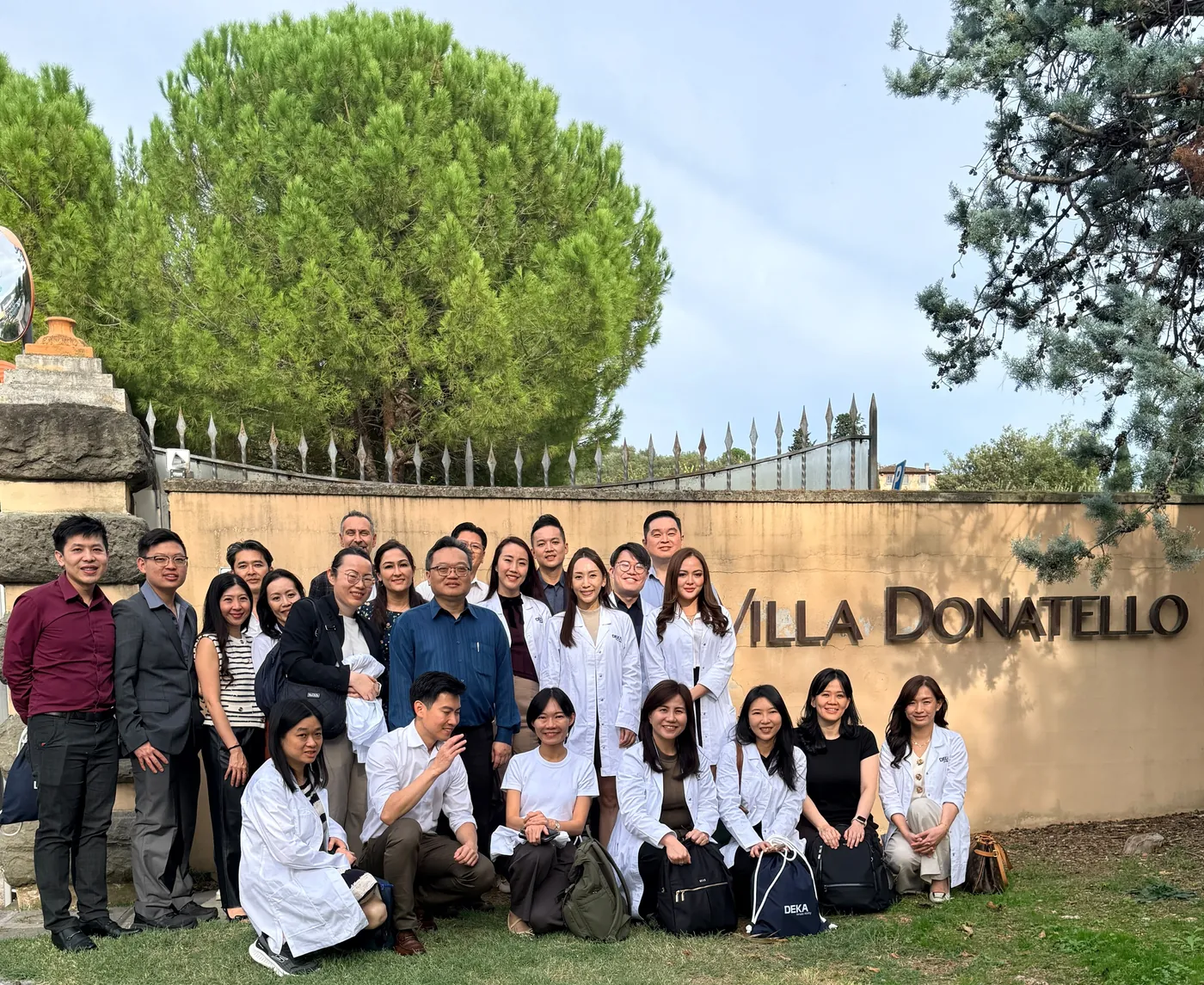 Physicians attending the October 2026 DEKA Academy gathered at the Villa Donatello sign, Florence