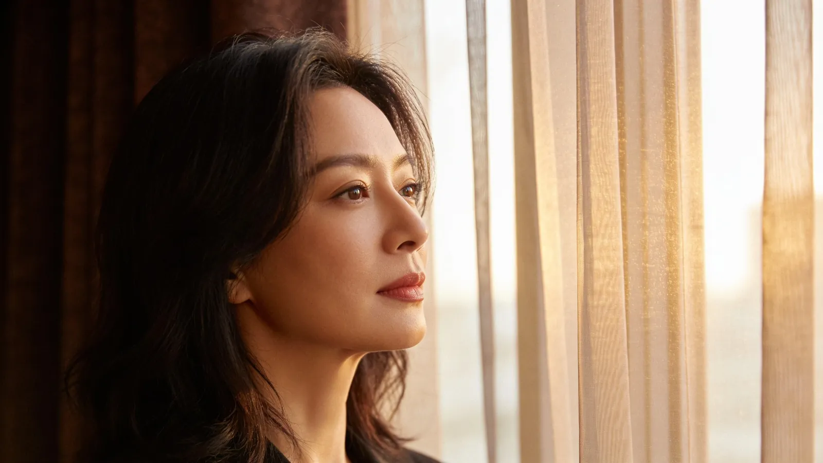 An East Asian woman in her mid 30s — illustrative image