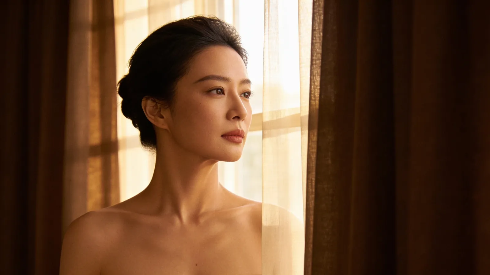 An East Asian woman in her 30s with smooth refined skin on her cheek and nose — illustrative image
