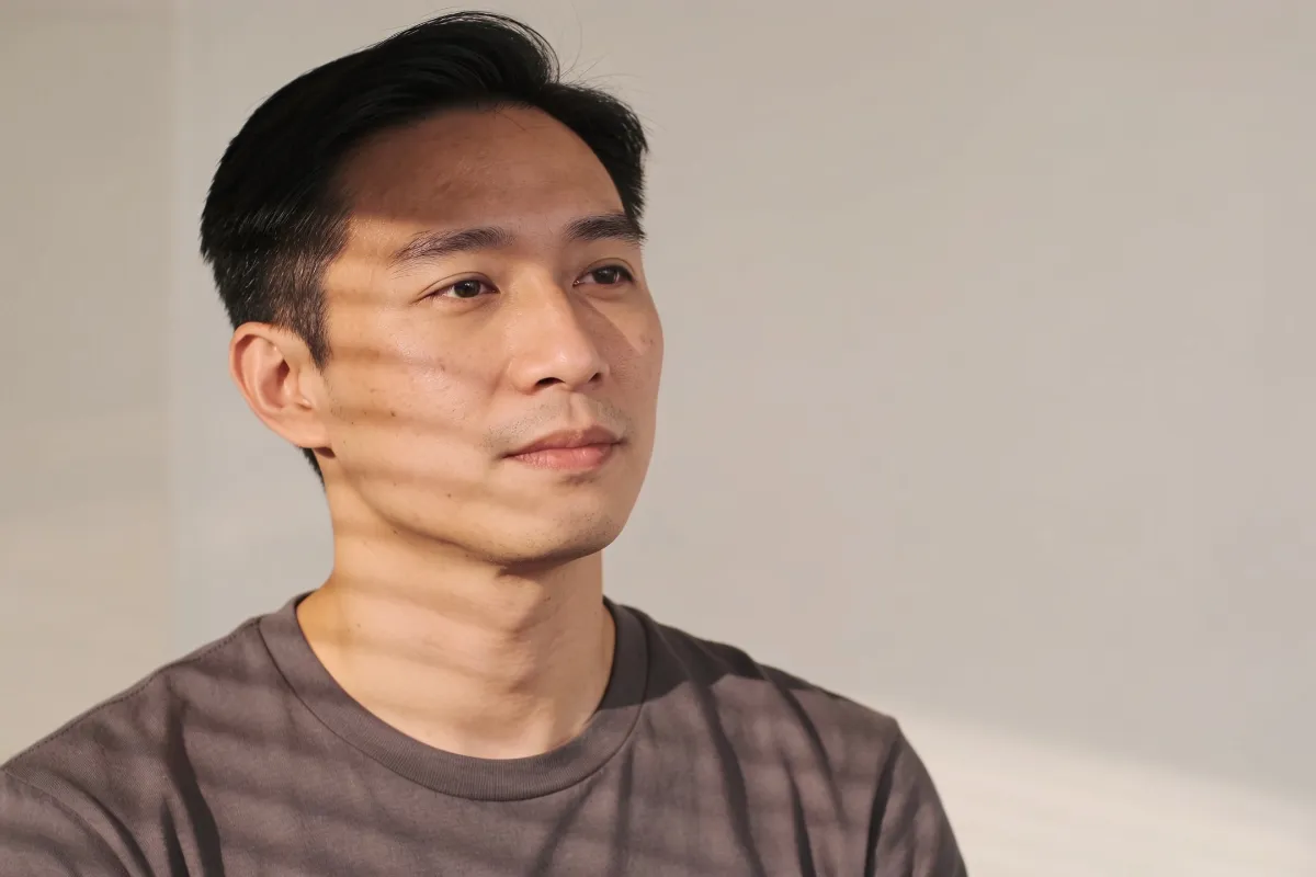 A man in his thirties with natural light across his cheek (illustrative image, not a patient)