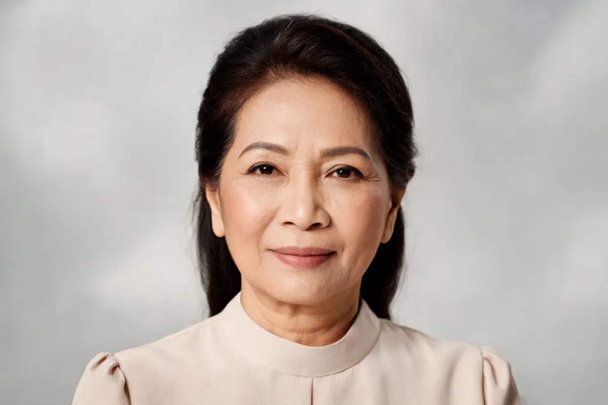 A woman in her fifties looking at the camera with a relaxed brow (illustrative image, not a patient)