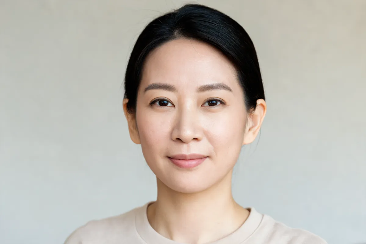 A woman in her thirties with her hair tucked behind her ear (illustrative image, not a patient)