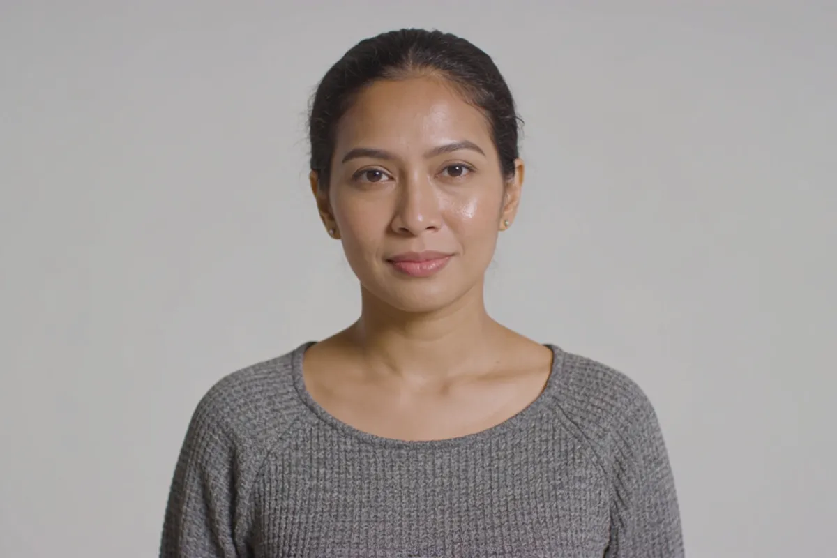 A woman in her thirties with dewy skin and hair pulled back (illustrative image, not a patient)